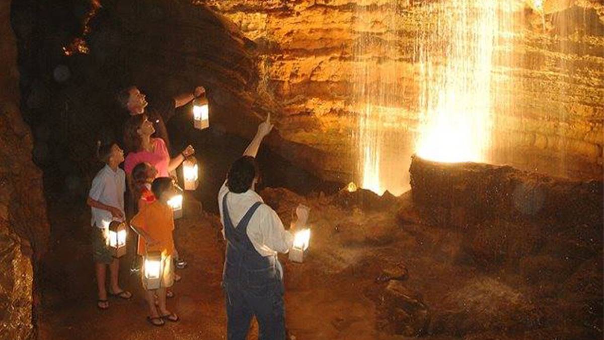 View looking down at people on a Lantern Light Tour of Marvel Cave at Silver Dollar City in Branson, Missouri, USA